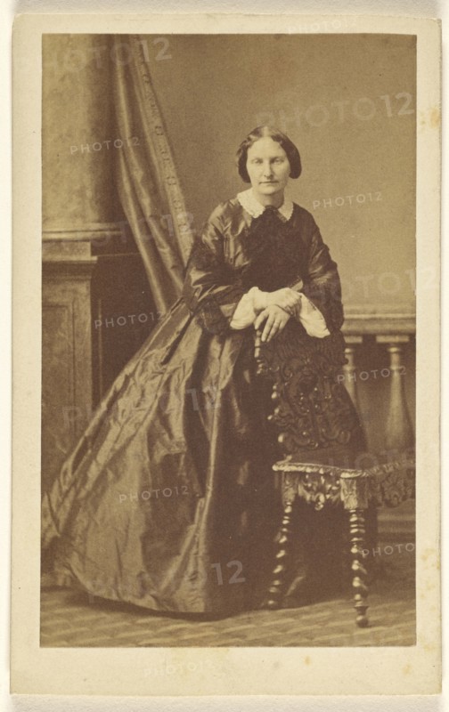 woman standing, leaning on chair back; Disdéri & Cie; 1862 - 1865; Albumen silver print