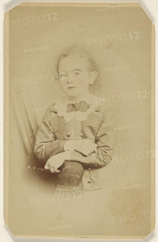 little girl with arms crossed, resting on chair arm, printed in vignette-style; William H. Seeler, American, active Philadelphia