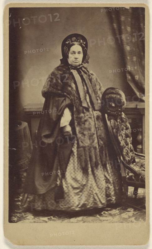 elderly woman wearing a fur coat and hat, standing; Partridge, American, active Bridgeport, Connecticut 1870s - 1890s, 1865