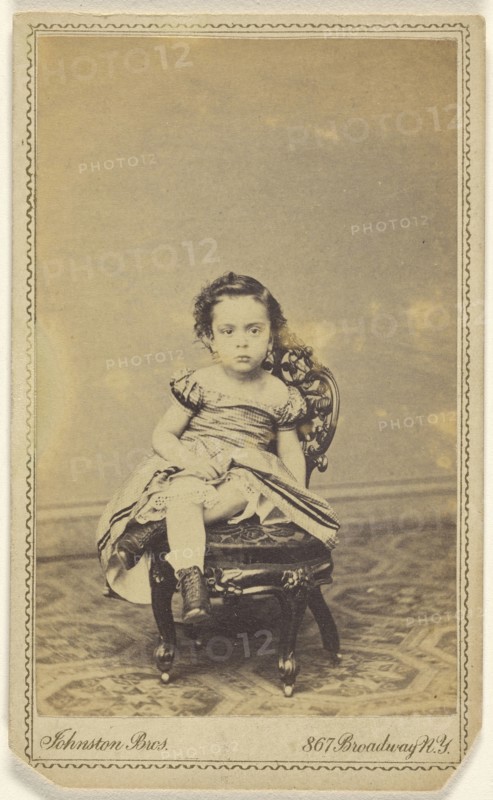 little girl seated in a small chair; Johnston Brothers R.G. & ? Johnston; 1870-1880; Albumen silver print