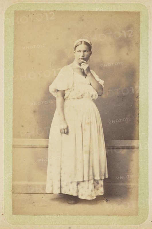 Woman posing in apron and bonnet; William Carrick, Scottish, 1827 - 1878, Russia; about 1860 - 1870; Albumen silver print