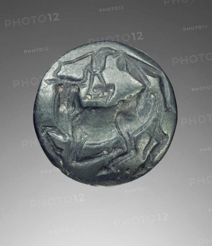 Lentoid engraved seal; Crete, Greece; 1450 - 1300 B.C; Blue-gray haematite; 7 × 1.9 cm, 2 3,4 × 3,4 in