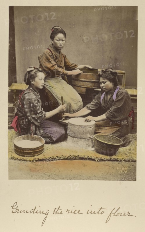 Grinding the rice into flour; Shinichi Suzuki, Japanese, 1835 - 1919, Japan; about 1873 - 1883; Hand-colored Albumen silver