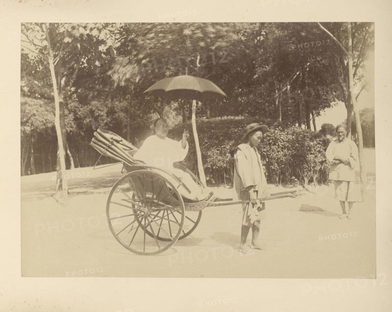 Rickshaw Driver and Passenger with Umbrella; Unknown maker; Peking, China; 1870 - 1890; Albumen silver print