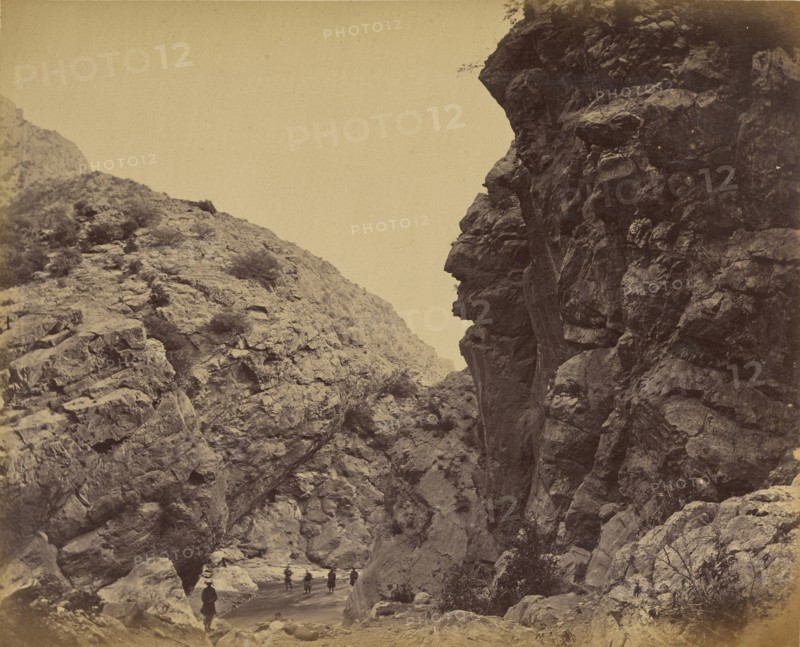 Figures walking path between hills; John Burke, British, active 1860s - 1870s, Afghanistan; 1878 - 1879; Albumen silver print
