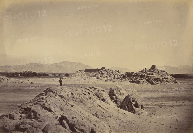 Man standing on rocks; John Burke, British, active 1860s - 1870s, Afghanistan; 1878 - 1879; Albumen silver print