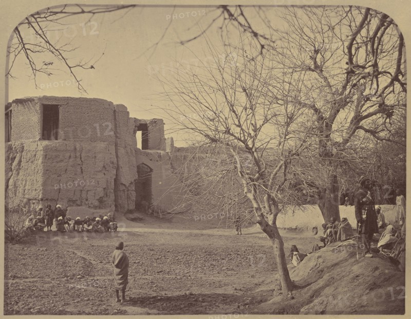 People in front of stone building; John Burke, British, active 1860s - 1870s, Afghanistan; 1878 - 1879; Albumen silver print