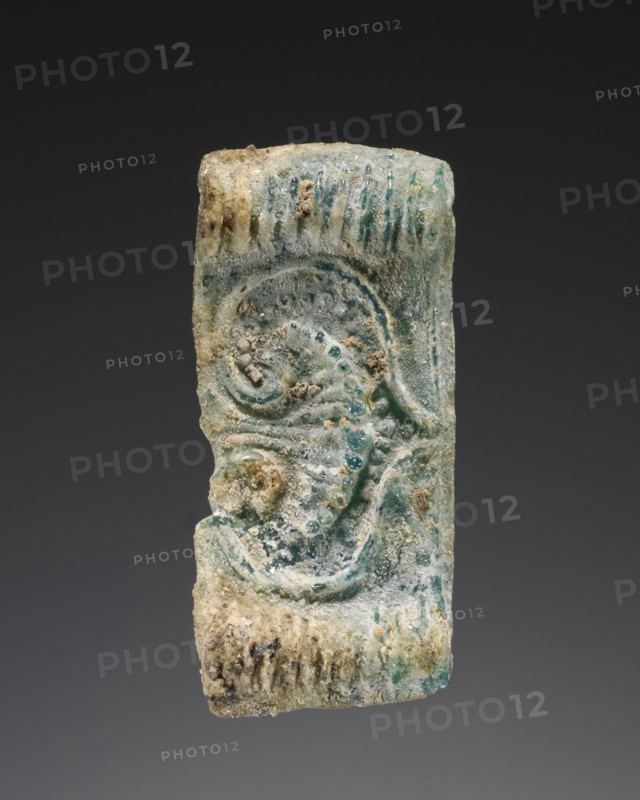 Cast pendant bead; Greece; about 14th century B.C; Glass; 2.9 × 1.3 × 0.5 cm, 1 1,8 × 1,2 × 3,16 in