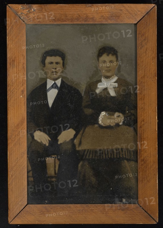Portrait of seated couple; United States; 1860s - 1880s; Hand-colored tintype; 20.5 x 12.7 cm, 8 1,16 x 5 in