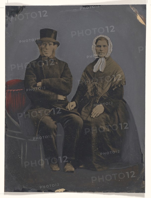 Portrait of seated couple; United States; 1860s - 1880s; Hand-colored tintype; Sheet: 19.9 x 15 cm, 7 13,16 x 5 7,8 in