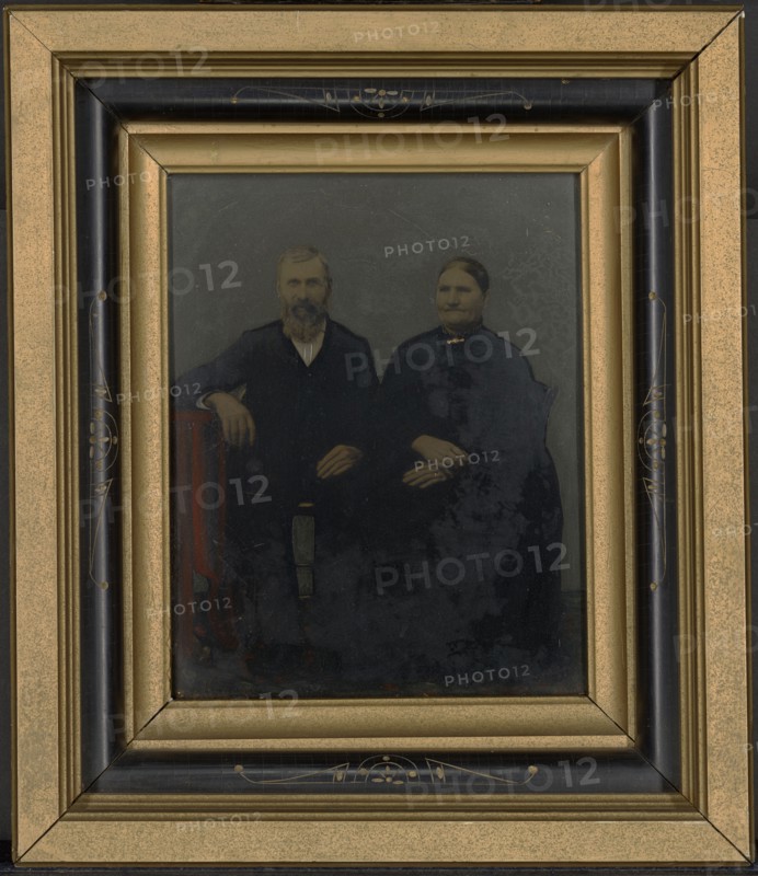 Portrait of seated couple; United States; 1860s - 1880s; Hand-colored tintype; 24 × 18.8 cm, 9 7,16 × 7 3,8 in