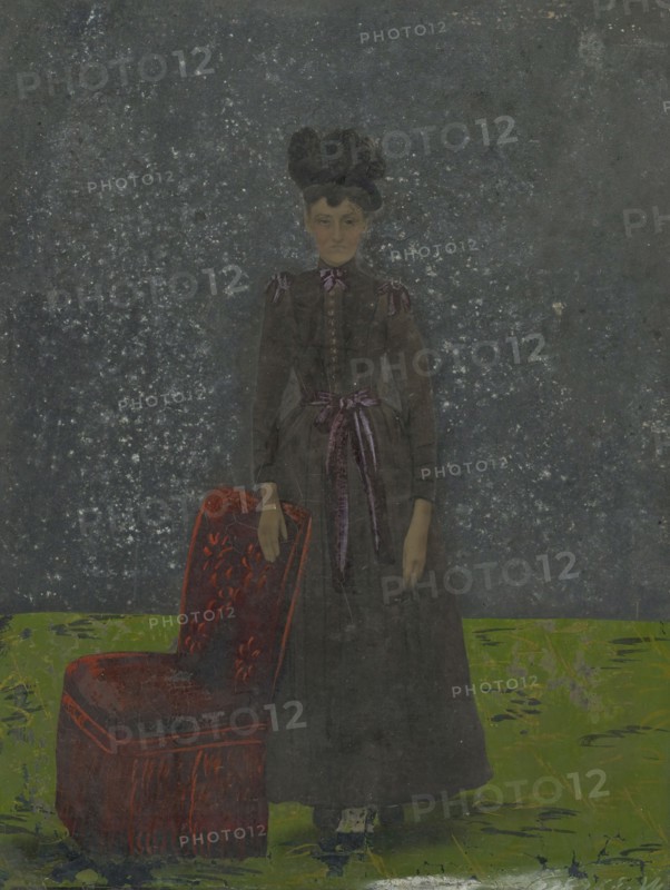Portrait of woman and chair; United States; 1860s - 1880s; Hand-colored tintype; Sheet: 25.5 x 19.6 cm, 10 1,16 x 7 11,16 in