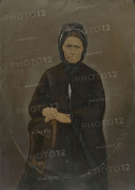 Portrait of woman in bonnet; United States; 1860s - 1880s; Hand-colored tintype; Sheet: 35.8 × 25.6 cm, 14 1,8 × 10 1,16 in
