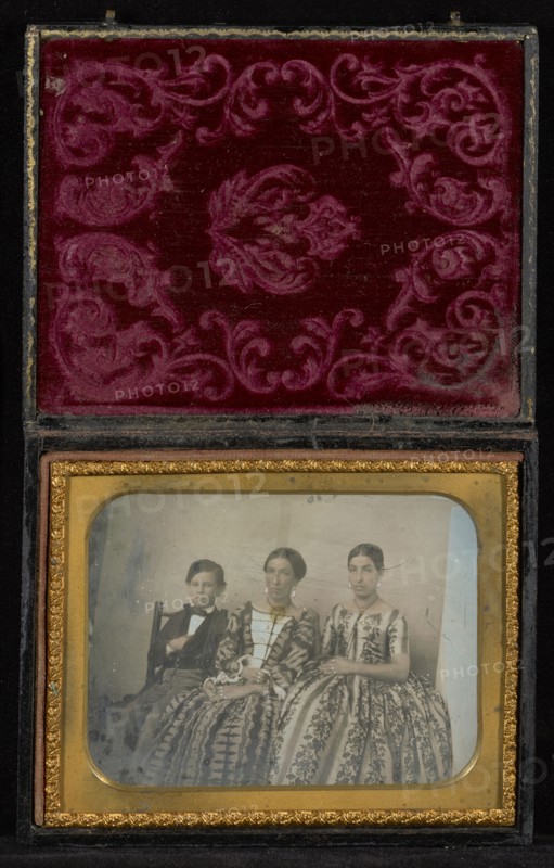 Horizontal Portrait of Two Seated Women and a Boy; Mexico; about 1850s; Hand-colored Daguerreotype