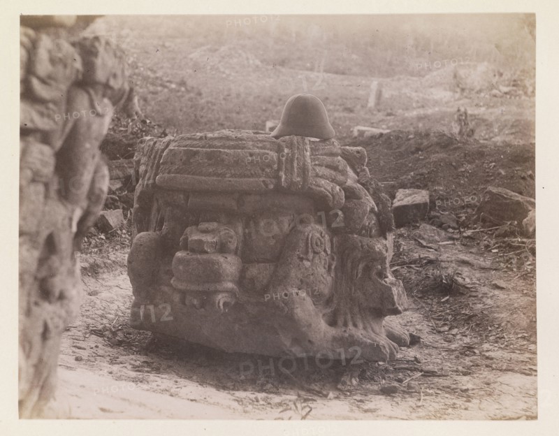 Warrior-head sculpture with pith helmet placed on top, Edmund Lincoln miscellaneous papers relating to the excavation of Maya