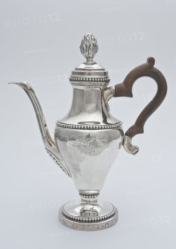 Silver jug with wooden handle with reversed pear-shaped body, with family crest, long narrow decorated spout and bud