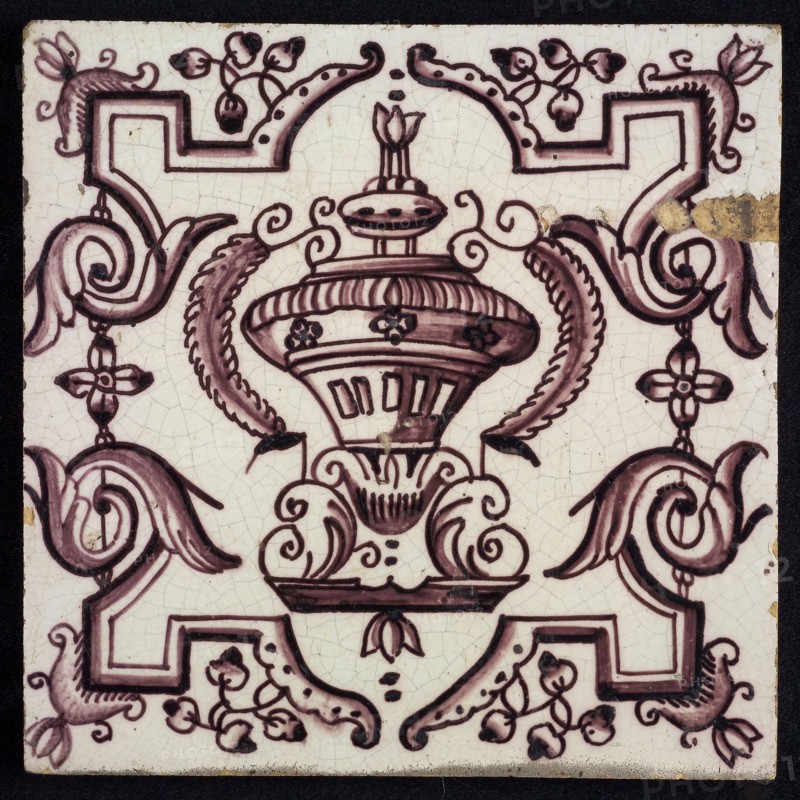 Tile, purple on white, vase with round floral ornaments, framed by régence decoration, wall tile tile sculpture ceramic