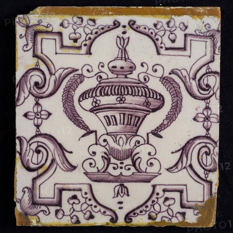 Tile, purple on white, vase with round floral ornaments, framed by régence decoration, wall tile tile sculpture ceramic