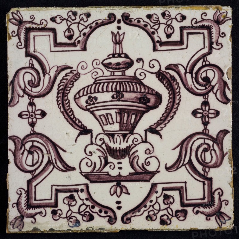 Tile, purple on white, vase with round floral ornaments, framed by régence decoration, wall tile tile sculpture ceramic