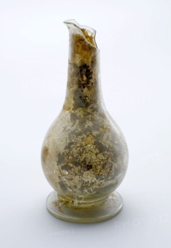 Small bulbous bottle or vial, (medicine?) Bottle holder bottomfound glass, free blown and shaped Small bulbous (pour?) Bottle