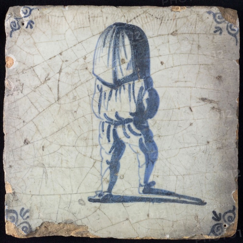 Occupation tile, blue with sack carrier seen on the back, corner motif ox's head, wall tile tile sculpture ceramic earthenware