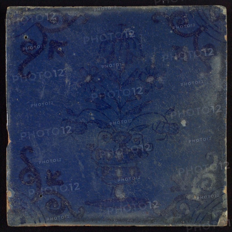 Tile, flower pot in blue on blue, corner motif oxenkop, misbaksel, wall tile tile sculpture ceramic earthenware glaze, baked 2x