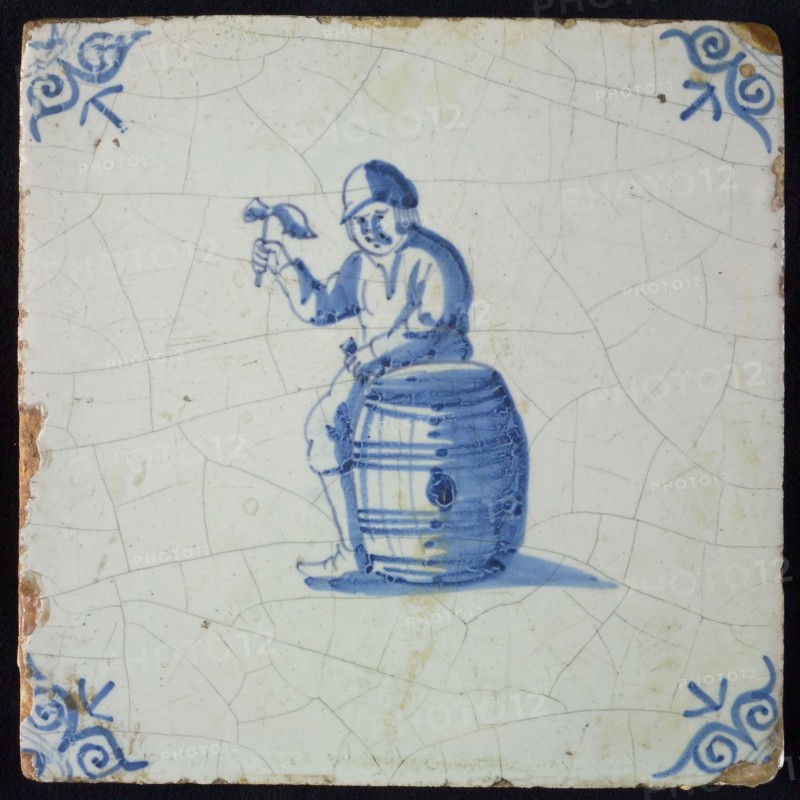 Occupation tile, blue with cooper, with raised hammer, corner motif oxen head, wall tile tile sculpture ceramic earthenware