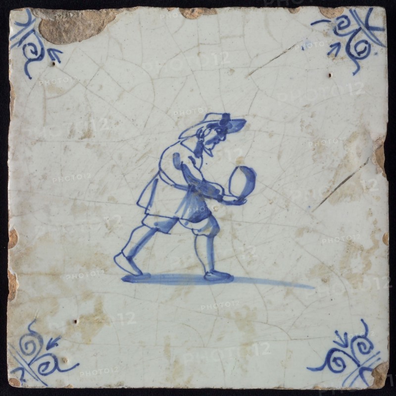 Occupation tile, blue with man who is bolting, corner motif ox's head, wall tile tile sculpture ceramic earthenware glaze, baked