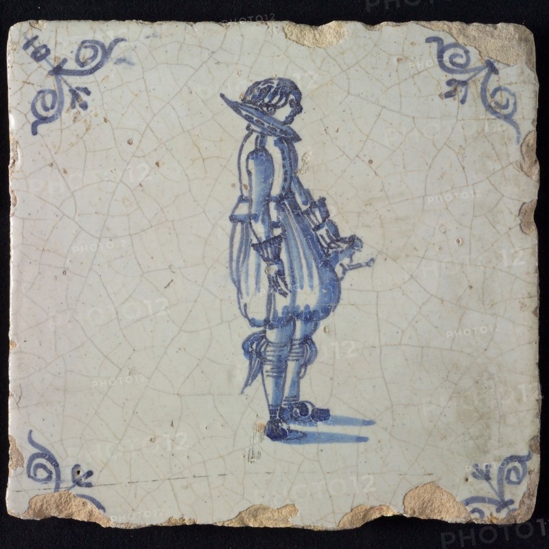 Occupation tile, blue with standing nobleman, corner motif ox's head, wall tile tile sculpture ceramic earthenware glaze, baked