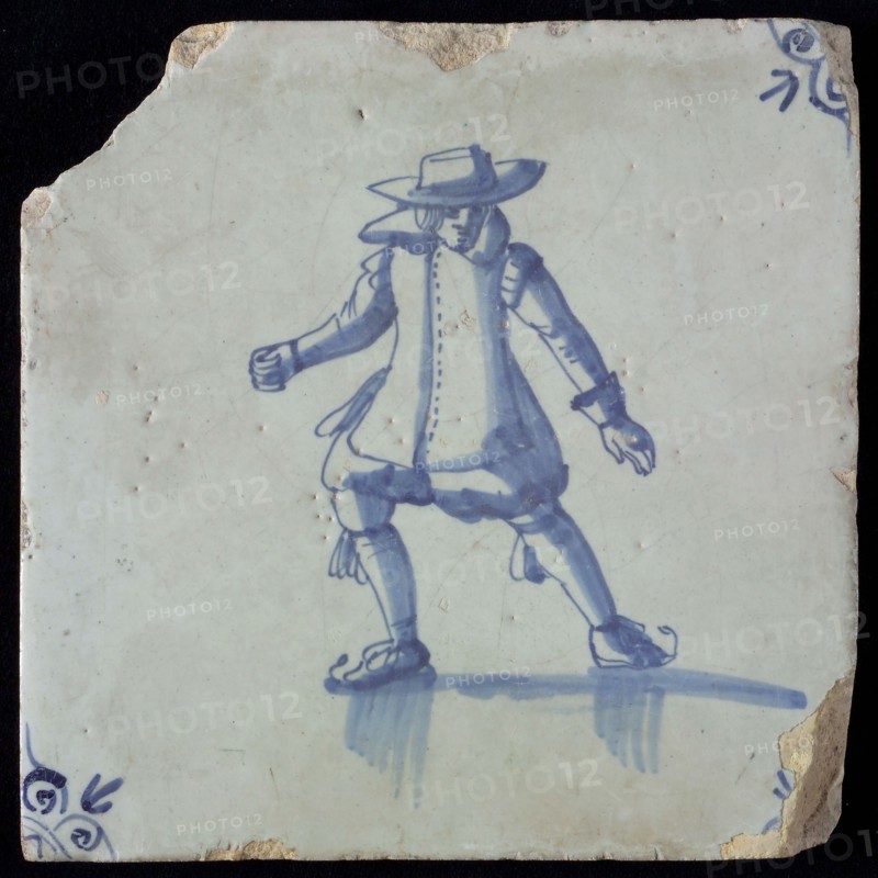 Figure tile, blue with skating man, nobleman, nicely dressed with big hat, corner pattern ox-head, wall tile tile sculpture