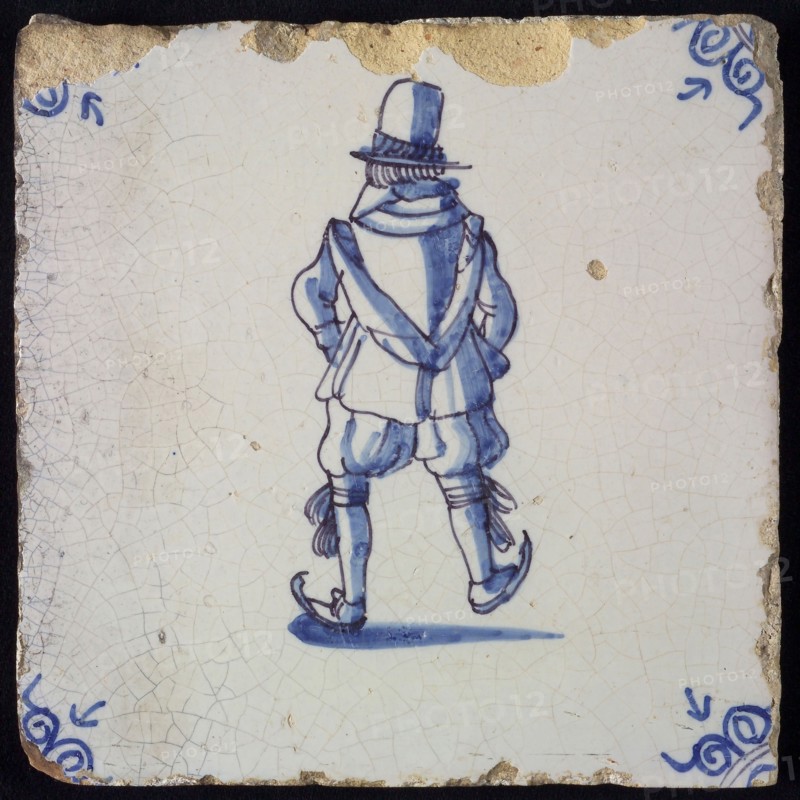 Figure tile, blue with skating man, seen from behind, nobleman with top hat, corner pattern ox head, wall tile tile sculpture
