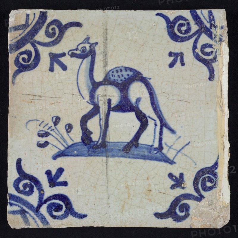 Animal tile, dromedary left on ground, in blue on white, corner design large ox head, wall tile tile sculpture ceramic