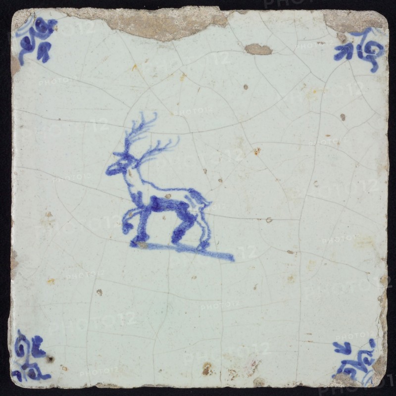 Animal tile, stepping deer to the left, in blue on white, corner motif oxen head, wall tile tile sculpture ceramic earthenware