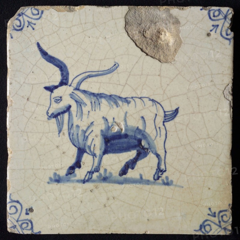 Animal tile, standing long-haired goat to the left, in blue on white, corner motif; ox head, wall tile tile sculpture ceramic