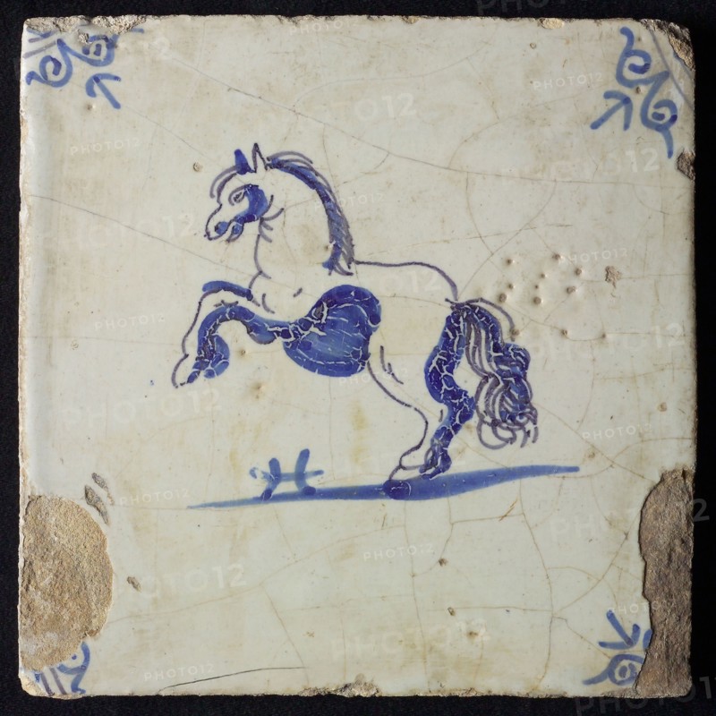 Animal tile, rearing horse to the left, in blue on white, corner motif oxen head, wall tile tile sculpture ceramic earthenware