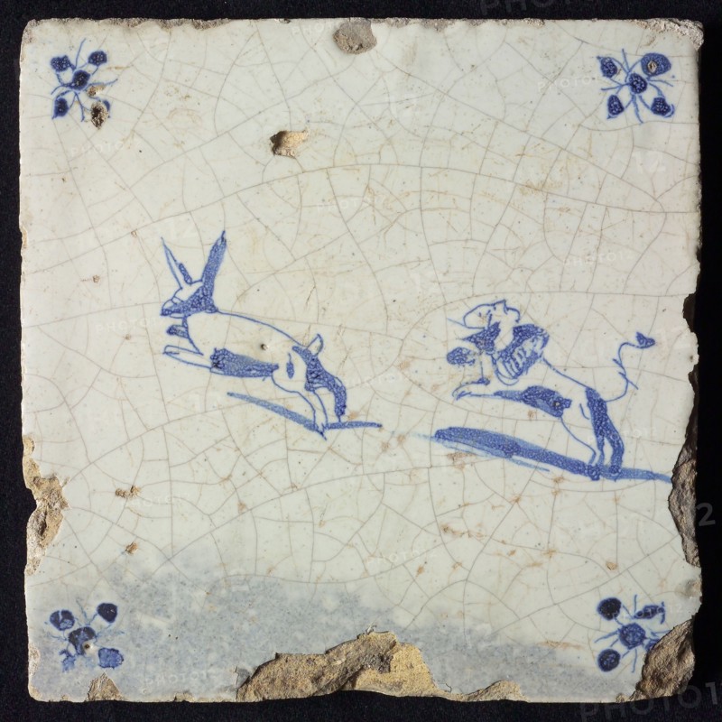 Animal tile, jumping hare followed by jumping dog to the left, in blue on white, corner motif spider, wall tile tile sculpture