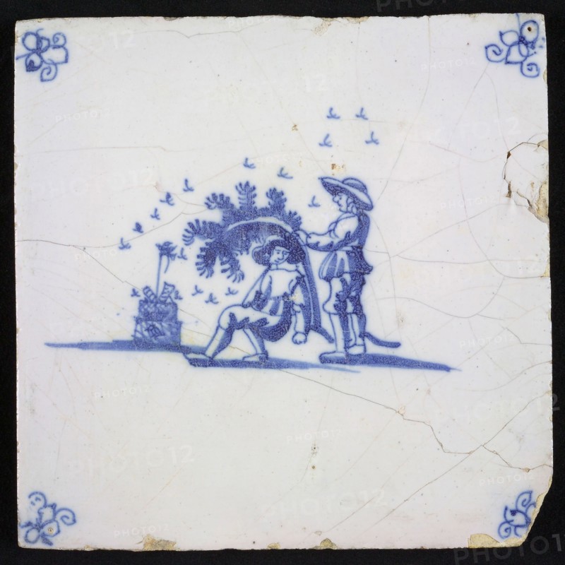 Scene tile, blue, with landscape containing two men and beehive with swarming bees, corner pattern spider, wall tile