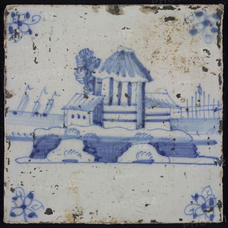 Scene tile, blue with landscape with high building, corner motif spider, wall tile tile sculpture ceramic earthenware glaze