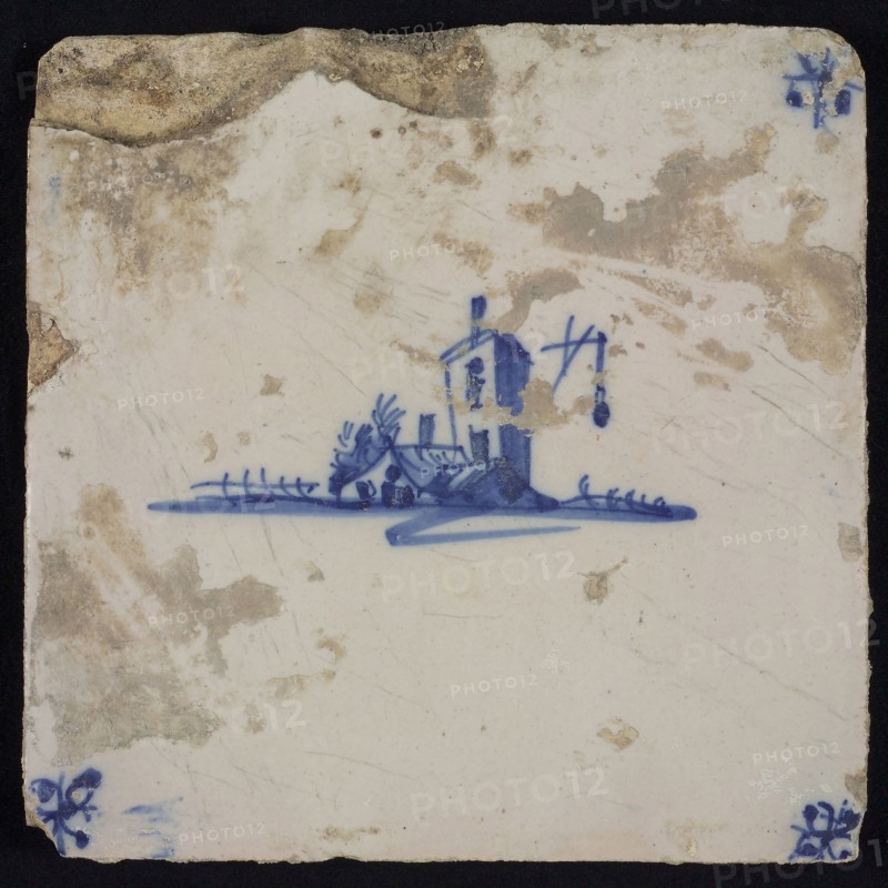 Scene tile, blue with sketch of square tower with fire beacon, corner pattern spider, wall tile tile sculpture ceramic