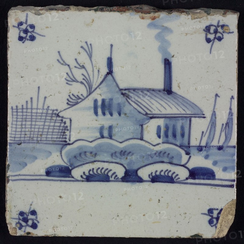 Scene tile, blue with landscape with house and barn, corner motif spider, wall tile tile sculpture ceramic earthenware glaze