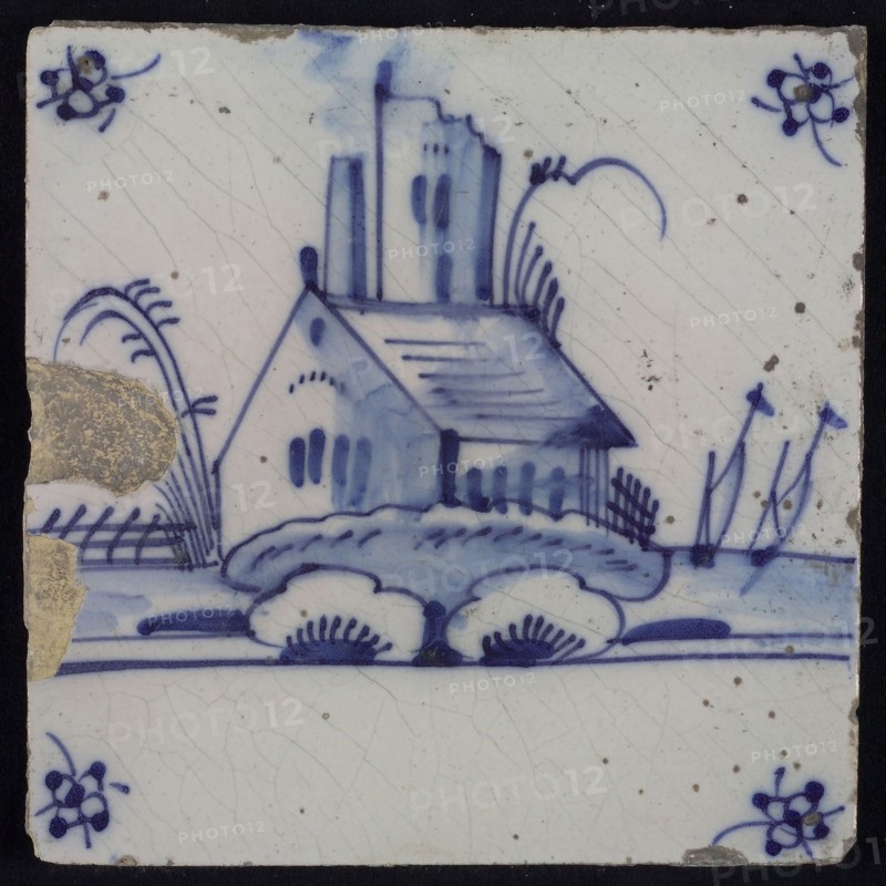Scene tile, blue with landscape with house with behind it ruin tower, corner motif spider, wall tile tile sculpture ceramic