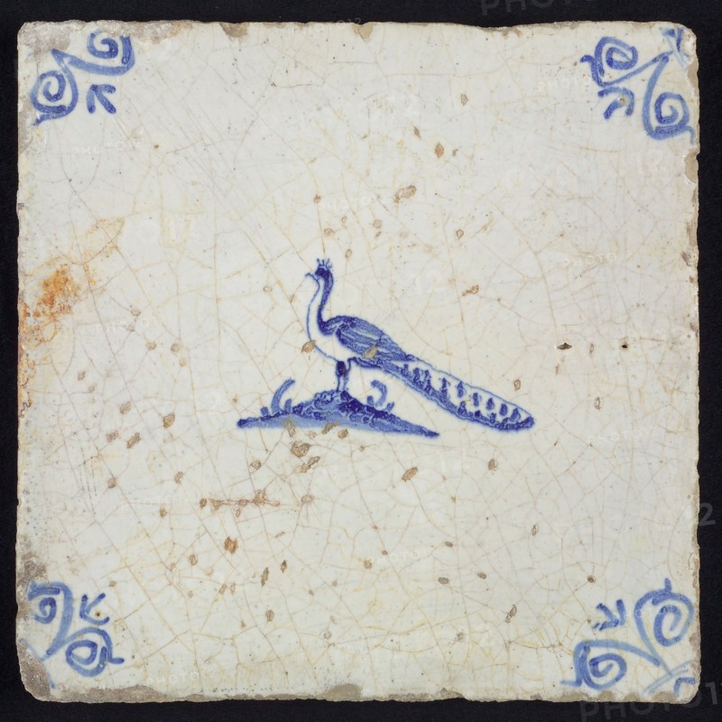 Animal tile, bird on ground to the left, in blue on white, corner motif ox's head, wall tile tile sculpture ceramic earthenware