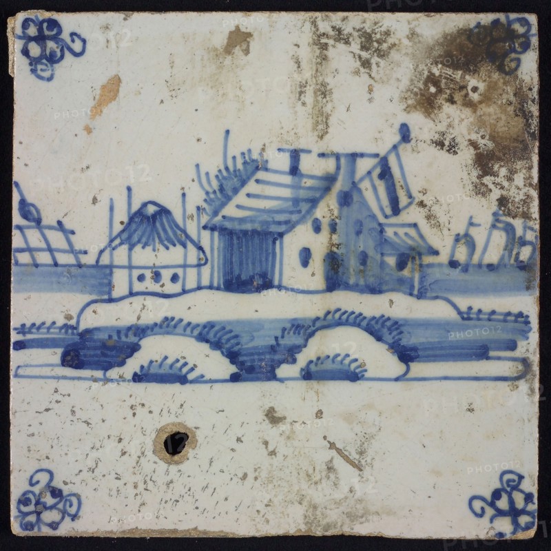 Scene tile, blue with landscape with house with flag and haystack, corner motif spider, wall tile tile sculpture ceramic