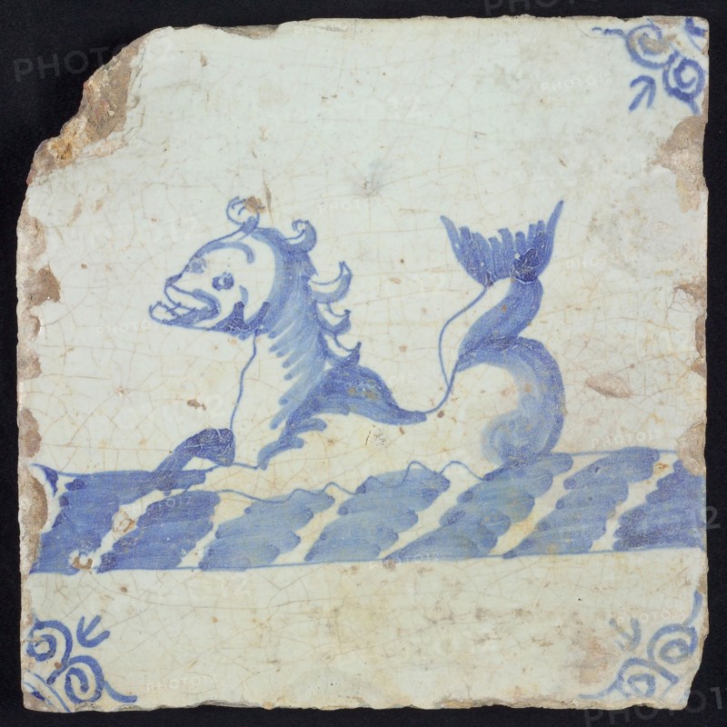 Animal tile, sea-washed in continuous water to the left, in blue on white, corner motif of ox-head, wall tile tile sculpture