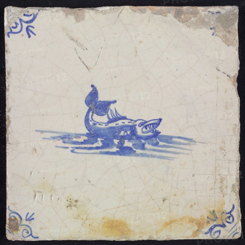 Animal tile, sea-based in water to the right, in blue on white, corner motif of ox-head, wall tile tile sculpture ceramic