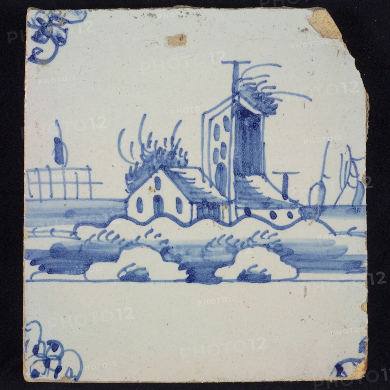 Scene tile, blue with landscape with houses and (fire?) Tower, corner motif spider, wall tile tile sculpture ceramic earthenware