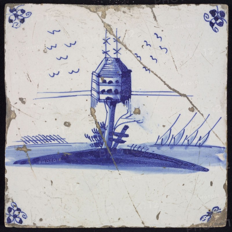Scene tile, blue with landscape with hexagonal dovecote on tree trunk, corner pattern spider, wall tile tile sculpture ceramic
