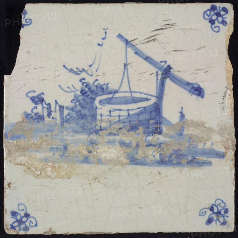 Scene tile, blue with landscape with well with lever, corner motif spider, wall tile tile sculpture ceramic earthenware glaze