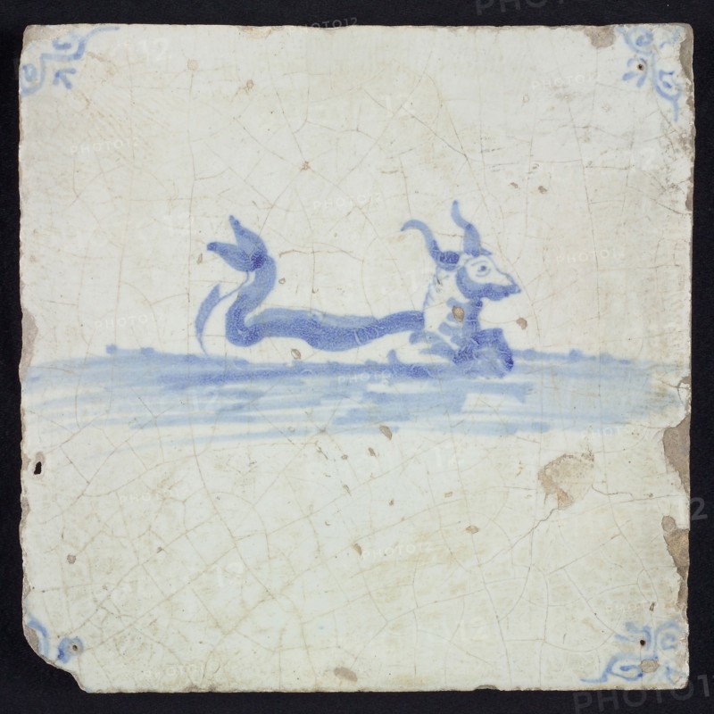 Sea creature tile, bovine with horns and curled fish tail in running water to the right, in blue on white, corner motif oxen