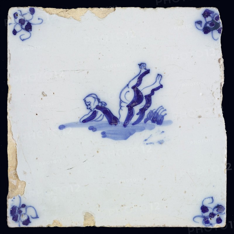 Sea creature tile, in blue on white, upper body of man and two legs upside down in water, corner pattern spider, wall tile